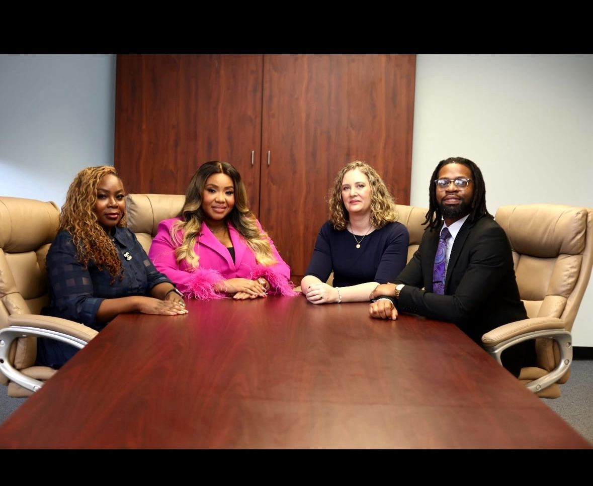 A team of attorneys sitting at a table